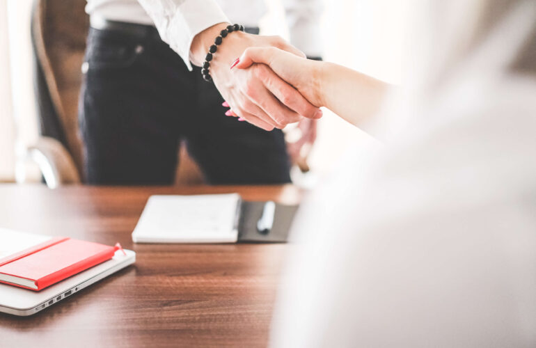 business-man-and-woman-handshake-in-work-office