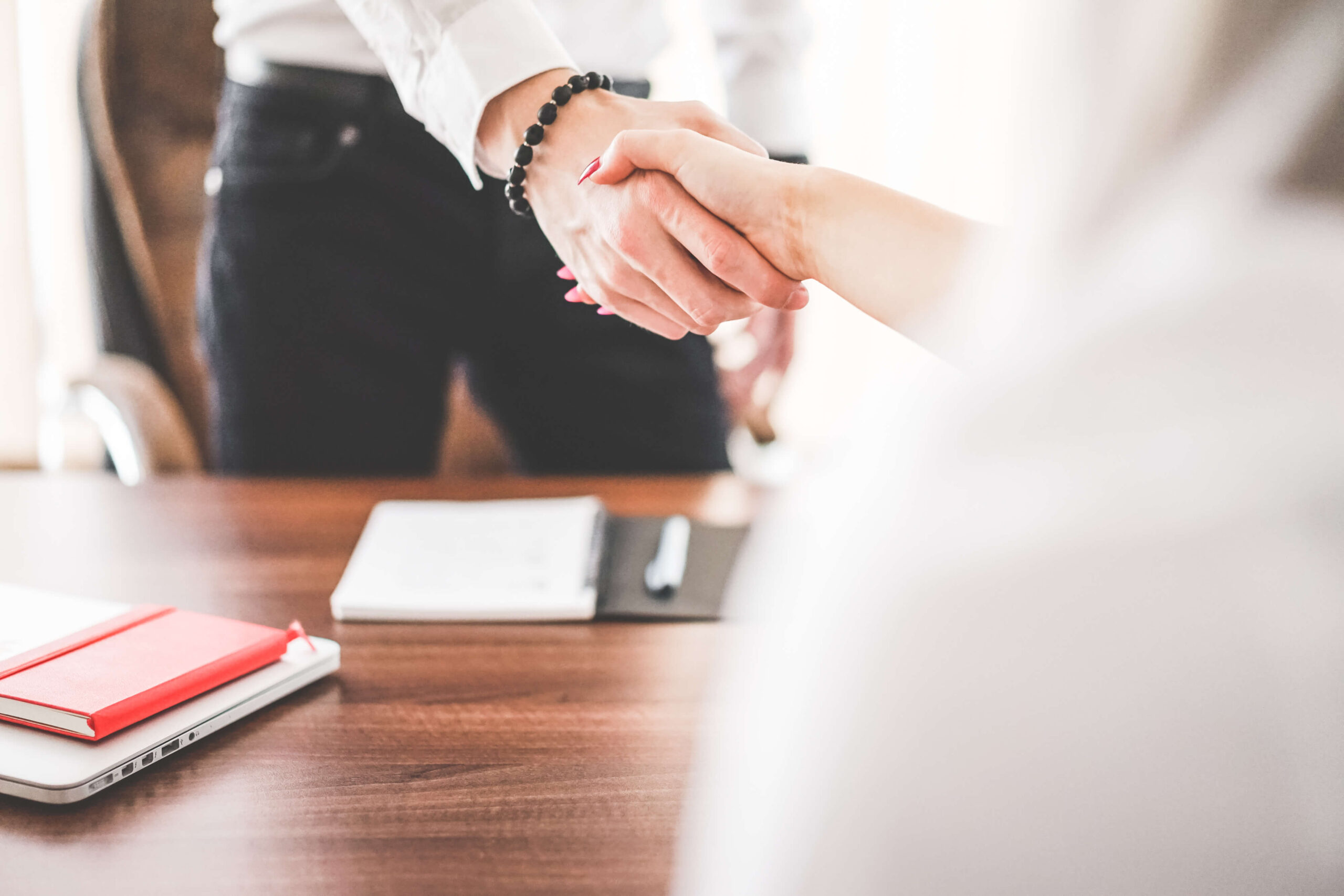 business-man-and-woman-handshake-in-work-office